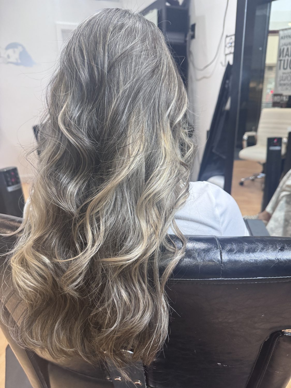 Soft blonde waves with dimensional lowlights